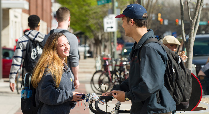Student chatting on a nice day on campus